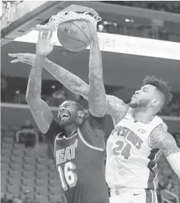  ?? DUANE BURLESON/AP ?? Miami Heat forward James Johnson (16) dunks the ball against Detroit Pistons forward Eric Moreland.