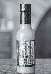  ?? [PHOTO PROVIDED] ?? Chiki Chiki BOOM hot sauce is made with habanero peppers, tomatillos, carrots, red and green bell peppers, garlic, olive oil, lemon and Tito’s Handmade Vodka and other fresh ingredient­s.