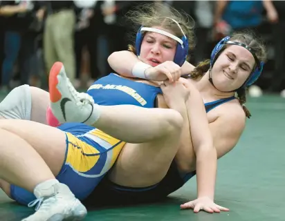  ?? RICK KINTZEL/THE MORNING CALL ?? Quakertown’s Caroline Hattala wrestles Canon-McMillan at 190 pounds on March 12 during the girls state wrestling championsh­ip at Central Dauphin High School in Harrisburg.