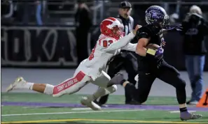  ?? BEA AHBECK/NEWS-SENTINEL ?? Above: Tokay's Joseph Filippini evades Lodi's Korbin Mason as he runs for a touchdown during their hometown rivalry game at Tokay’s Hubbard Field on Nov. 2. Below: Lodi's Christian Zamora breaks loose for a touchdown during the same game.