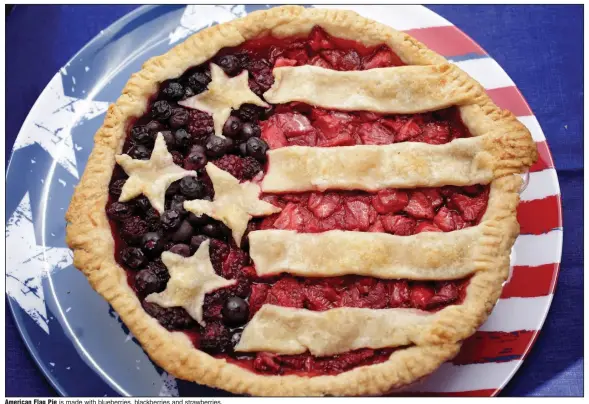  ?? (TNS/St. Louis Post-Dispatch/Hillary Levin) ?? American Flag Pie is made with blueberrie­s, blackberri­es and strawberri­es.