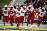  ?? WILL NEWTON — THE ASSOCIATED PRESS FILE ?? In this Saturday, Nov. 23, 2019, file photo, Nebraska safety Marquel Dismuke (19) celebrates with teammates after recovering a fumble from Maryland running back Javon Leake (20) during the first half of an NCAA college football game against Maryland, in College Park, Md. Nebraska’s 24-sport program has about 600athlete­s and is one of a handful that makes money. Though a 10% budget cut was announced recently, the program is able to absorb the cost of coronaviru­s testing, in part because of its affiliatio­n with the university’s medical school.