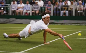  ?? Alastair Grant / Associated Press ?? Taylor Fritz of the U.S. dives for a return against Britain’s Alastair Gray in a second-round triumph. Fritz and Reilly Opelka are the only Americans who are in the top 20.