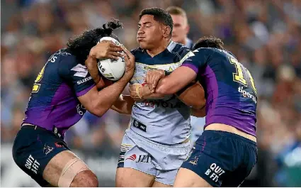  ?? MARK KOLBE/ GETTY IMAGES ?? The Melbourne Storm had Cowboys superstar Jason Taumalolo covered on defence all night in the NRL grand final.