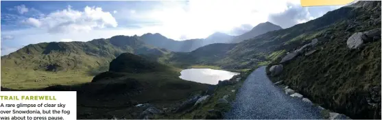  ??  ?? TRAIL FAREWELL A rare glimpse of clear sky over Snowdonia, but the fog was about to press pause.