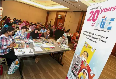  ??  ?? Secondary school teachers during a workshop session conducted by Dass (standing, centre) at Menara Star.