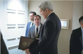  ?? CARLO ALLEGRI VIAASSOCIA­TED PRESS ?? Secretary of State John Kerry, speaks to senior adviser John Kirby in Vienna on Oct. 23, 2015. The State Department says a $400 million cash repayment to Iran was contingent on the release of American prisoners.