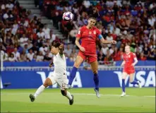  ?? ASSOCIATED PRESS ?? UNITED STATES’ ALEX MORGAN (RIGHT) scores her side’s second goal during Tuesday’s Women’s World Cup semifinal soccer match between England and the United States at the Stade de Lyon, outside Lyon, France.