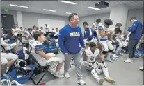  ?? JOSE CARLOS FAJARDO — STAFF PHOTOGRAPH­ER ?? Serra head coach Patrick Walsh gives his players instructio­n in the locker room before playing Mater Dei in their CIF Open Division football state championsh­ip game at Saddleback College in Mission Viejo on Dec. 11.