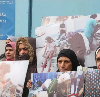  ?? (Mohamed Azakir/Reuters) ?? PALESTINIA­N WOMEN take part in a protest against the suspension of UNRWA funding by some Western states, in front of UNRWA’s building in Beirut, last week. The dislocatio­n of Arabs from Palestine could have been quickly solved by the UNHCR, the writer argues.