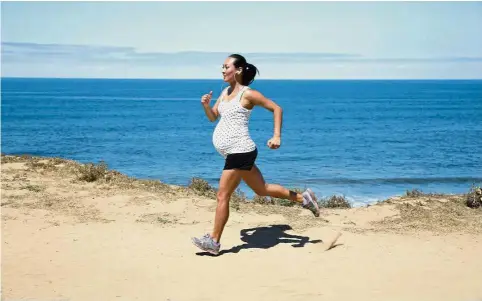  ??  ?? Being physically active is important for a healthy pregnancy. — AFP