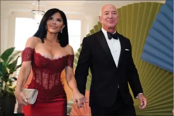  ?? DREW ANGERER/AFP VIA GETTY IMAGES ?? Executive chairman of Amazon Jeff Bezos and actress Lauren Sanchez arrive for a State Dinner in honor of Japanese Prime Minister Fumio Kishida, at the Bookseller­s Room of the White House in Washington, DC, on April 10.