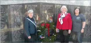  ?? CAROL ROLF/CONTRIBUTI­NG PHOTOGRAPH­ER ?? Local residents participat­ing in the National Wreaths Across America State House Ceremony on Dec. 13 at the Vietnam Veterans Memorial on the state Capitol grounds in Little Rock are, from left, Junelle Mongno of Cabot and Jessie Johnson of North Little Rock, both members of the Major Jacob Gray Chapter, Arkansas State Society Daughters of the American Revolution; and Angela Beason of Beebe, coordinato­r with her husband, Bubba Beason, of the Wreaths Across America project at the Little Rock National Cemetery.