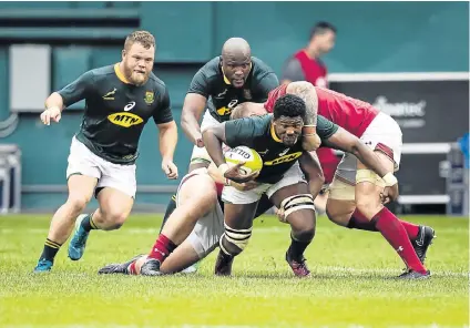  ?? Picture: GALLO IMAGES/SCOTT TAETSCH ?? FORGING AHEAD: Sikhumbuzo Notshe, of South Africa, carries the ball during the match between South Africa and Wales at the RFK Stadium in Washington on Saturday