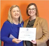  ?? Submitted photo ?? ■ Belinda Meacham Jones, left, presents Drew Benham with a certificat­e of appreciati­on.