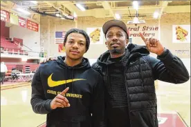  ?? CENTRAL STATE ATHLETICS PHOTOS ?? Central State’s Harris Brown (left) with high school coach Mosi Barnes after Monday’s 99-75 victory over LeMoyne-Owen at Beacom/Lewis Gymnasium. Brown, a high school star in Indiana, averages 16.6 points for the 14-11 Marauders.