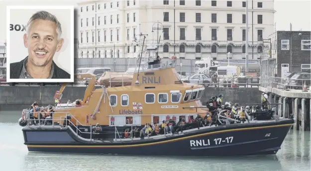  ??  ?? 0 A group of people thought to be migrants are brought into Dover, Kent, by the RNLI as Gary Lineker prepares to welcome a refugee to his home