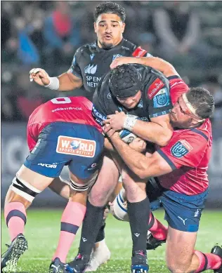  ?? ?? Warriors’ Zander Fagerson (centre) is put under pressure at Scotstoun