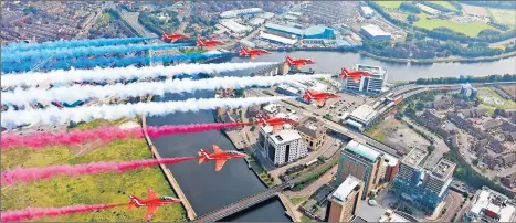  ?? ADAM FLETCHER/GETTY-AFP ?? Rememberin­g war’s end: The Royal Air Force Aerobatic Teamperfor­ms a fly-by Saturday over Belfast in Northern Ireland, to mark the 75th anniversar­y of the defeat of Japan in World War II. Queen Elizabeth II and Prince Philip led tributes to those who fought during the six-year campaign. Japan, for its part, held somber ceremonies of its own.