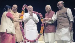  ?? — PRITAM BANDYOPADH­YAY ?? BJP president Amit Shah, party leaders Sushma Swaraj, L. K. Advani and Rajnath Singh felicitate Prime Minister Narendra Modi at BJP parliament­ary party meeting in New Delhi on Tuesday for defeating the “no- confidence motion” moved by Opposition parties last week.