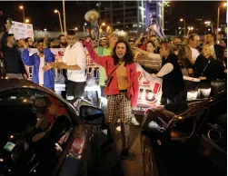  ?? (Ammar Awad/Reuters) ?? RESIDENTS OF the South protest against the Gaza ceasefire in Tel Aviv last week.