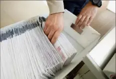  ?? Matt Smith / For Spotlight PA ?? Mail ballots are sorted and counted by workers on Election Day 2020 in Northampto­n County.