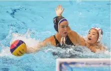  ?? Clive Rose / Getty Images ?? Stanford alum Makenzie Fischer evades pressure from Japan’s Kako Kawaguchi during a preliminar­yround match.