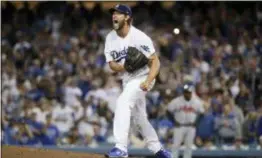  ?? JAE C. HONG — THE ASSOCIATED PRESS FILE ?? Dodgers pitcher Clayton Kershaw reacts during Game 2 of the team’s National League Division Series against the Braves in Los Angeles.