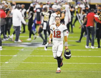  ?? Brett Duke / Associated Press ?? Tampa Bay quarterbac­k Tom Brady was 15for28 for 157 yards and one TD through the first 54 minutes. He padded his numbers in garbage time, finishing with 239 yards and two TDs.