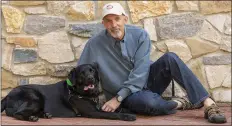  ?? JESS BLACKWELL PHOTOGRAPH­Y ?? Philip Tedeschi, director emeritus of the Institute for Humananima­l Connection at the University of Denver, poses with his dog, Samara, on campus in Denver on July 25, 2018. In the eyes of the law, pets are property when it comes to divorce.
But new ways of working out custody of the dog, cat or parrot have sprung up in recent years. There are special mediators and a push for “petnups” to avoid courtroom disputes.