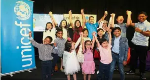  ??  ?? Future leaders: Children posing after they presented the media ‘takeover’ campaign at Unicef’s World Children’s Day press event.