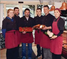  ??  ?? Brother’s James and Jerry O’Learys of O’Leary’s Family Butchers in Millstreet and staff show off dishes short-listed for the 2016 Blas na hÉireann Irish Food Awards.