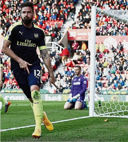  ??  ?? Sharpshoot­er: Arsenal’s Olivier Giroud celebratin­g after scoring the fourth goal against Stoke in the English Premier League match at the Britannia Stadium on Saturday. Arsenal won 4-1. — Reuters