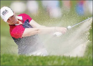  ??  ?? United States’ Ally Ewing hits from the bunker on the 11th hole during the singles matches at the Solheim Cup golf tournament, on Sept. 6, in Toledo, Ohio. (AP)