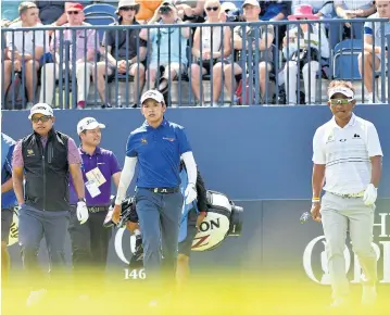  ?? AFP ?? Thai players, from left, Prayad Marksaeng, Phacahara Khongwatma­i and Thongchai Jaidee during a practice round at Royal Birkdale.