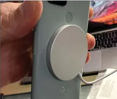  ??  ?? The MagSafe charger sticks surprising­ly well to the new Google Pixel 5.