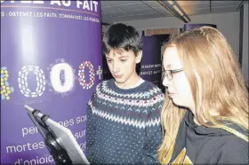  ?? FRAM DINSHAW/ TRURO NEWS ?? École acadienne students Riley Leblanc and Emily Dennis learned how di cult it is to  nd out if a seemingly normal pill had a lethal dose of fentanyl or other opioids at their school on Dec. 13. They were two of dozens of Grade 8 to 12 students who attended learning sessions being run by the national Know More Campaign.
