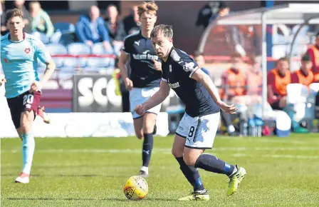  ??  ?? Dundee midfielder Paul McGowan tries to open up the Hearts defence during the 1-1 draw at Dens on Sunday.