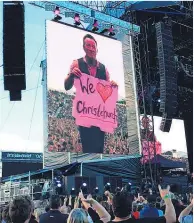  ?? Picture (main) / Getty Images ?? Bruce Springstee­n took requests — and the odd hand-made sign — from the crowd.