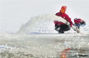  ?? CHRIS MIKULA / OTTAWA CITIZEN ?? Crews flood the ice ahead of the opening of the Rideau Canal Skateway in Ottawa. Similar action — on a much larger scale — is being proposed to preserve Arctic ice.