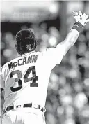  ?? Associated Press ?? n Detroit Tigers catcher James McCann raises his arm as he rounds first base after his two-run home run Friday during the seventh inning against the Boston Red Sox in Detroit.