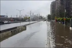  ?? JAKE OFFENHARTZ — THE ASSOCIATED PRESS ?? In this image taken from video, a section of the FDR Drive sits submerged in flood waters, Friday, Sept. 29, 2023, in New York. A potent rush-hour rainstorm has swamped the New York metropolit­an area. The deluge Friday shut down swaths of the subway system, flooded some streets and highways, and cut off access to at least one terminal at Laguardia Airport.