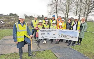  ?? ?? Turf-cutting time North Lanarkshir­e education convener Councillor Frank Mcnally (front) and pupils with Michael Ross of Hub South West, James Mckinstry of the council, Graham Johnston of NHS Lanarkshir­e, Andy Mclinden of Robertson Constructi­on, Maggs Thomson of Health & Social Care North Lanarkshir­e, Chryston High shared head Carolyn Rooney, Councillor John Mclaren and Chryston Primary acting depute head Lynne Bradshaw