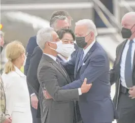  ?? EUGENE HOSHIKO/AP ?? Former Chicago Mayor and current U.S. Ambassador to Japan Rahm Emanuel greets President Joe Biden at an air base near Tokyo on Sunday.