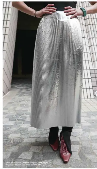  ??  ?? Silver pleated skirt _ Maison Margiela, from Joyce
Bracelets, trousers and boots stylist’s own