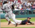  ?? RON SCHWANE — ASSOCIATED PRESS ?? This diving stop and throw to second base by Giovanny Urshela in the eighth inning on Sept. 13 helped save the Indians’ victory over the Tigers.