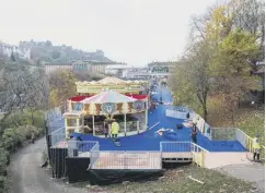  ??  ?? 0 Funfair rides being erected as part of the Christmas market