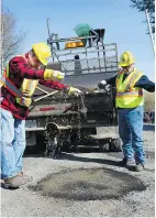  ?? JENELLE SCHNEIDER/PNG FILES ?? Crews are available 24 hours a day in case of emergency and require less than 48 hours to permanentl­y fix potholes on city streets.