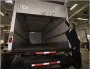  ?? ARLYN MCADOREY — THE CANADIAN PRESS VIA AP ?? Police officers open the back of a recovered truck that allegedly held stolen gold from Pearson Internatio­nal Airport, in Brampton, Ontario, on Wednesday.