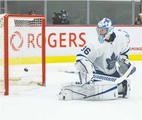  ?? BOB FRID / USA TODAY SPORTS FILES ?? Leafs goalie Jack Campbell watches the puck go by him in Sunday’s loss in Vancouver. After a red-hot start to the season, Campbell in his last four starts has allowed 14 goals, a good number of them stoppable, Steve Simmons writes.